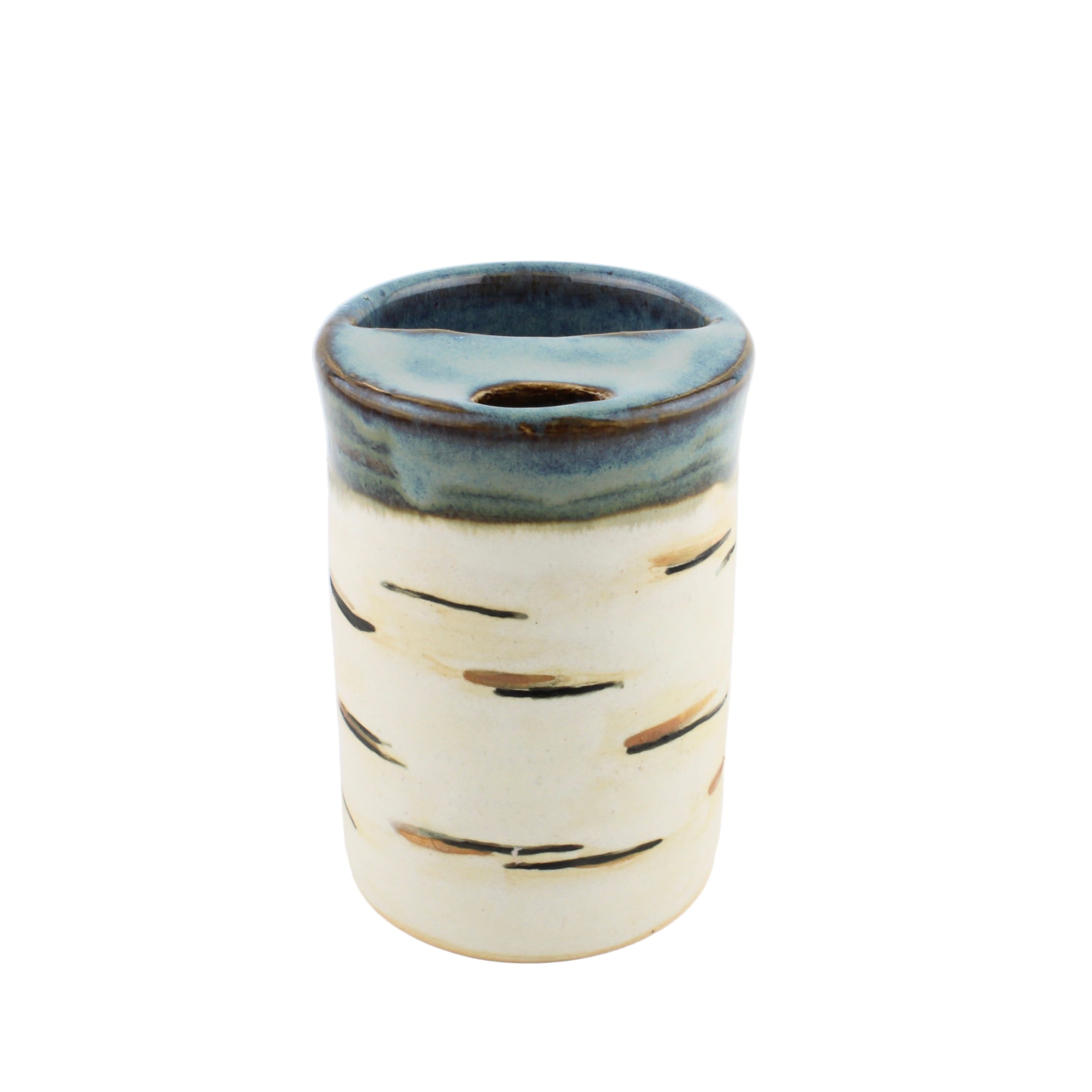 Ceramic tumbler with blue rim and white body on a white background